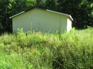 sold .267 +/- acres located on Old Corbin Pike with a 28’X32’ building that has electric and insulation in the walls