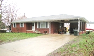 SOLD! REDUCED Brick home with three bedrooms, bath and half, living room, eat-in-kitchen, single carport(attached). 